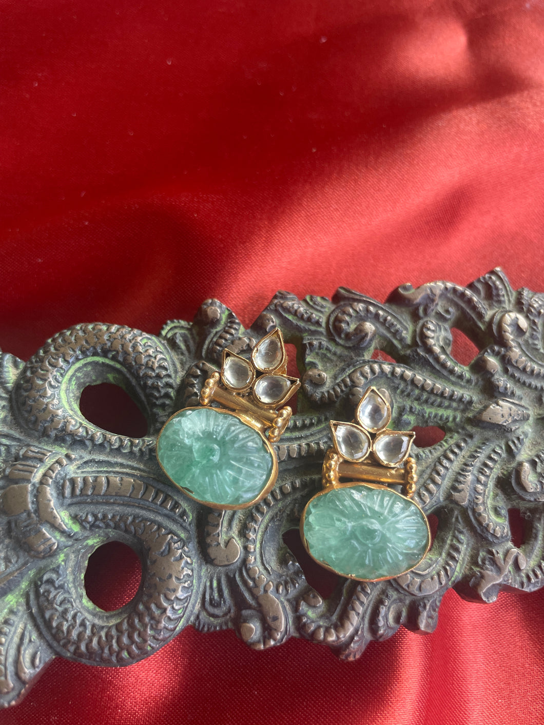 Silver 92.5 gold polish kundan studs with carved emerald stone