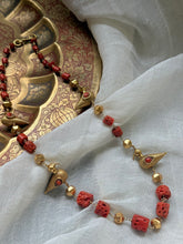 Load image into Gallery viewer, Coral &amp; bird necklace in gold tone
