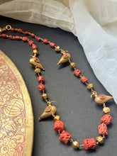 Load image into Gallery viewer, Coral &amp; bird necklace in gold tone
